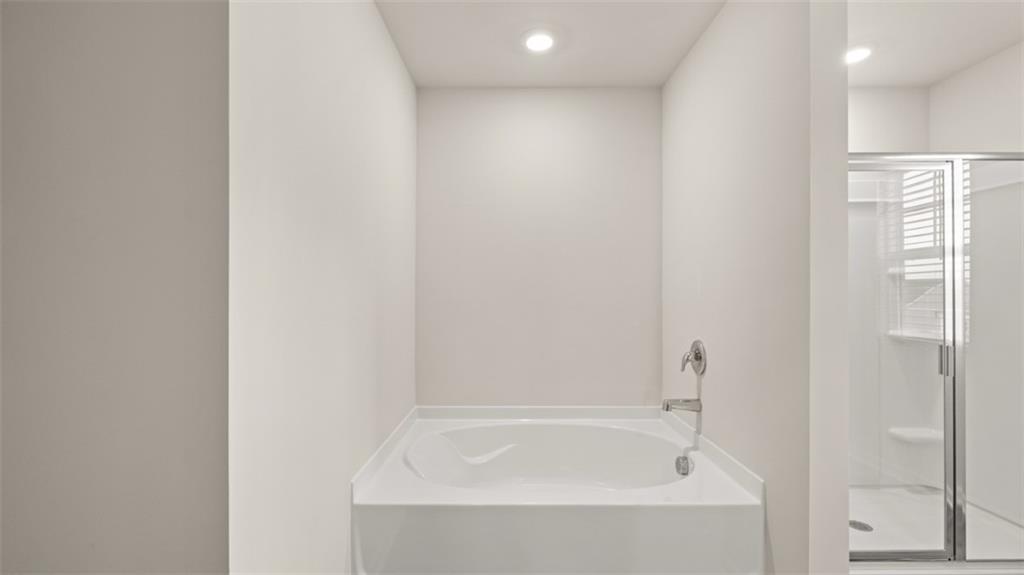 97 Defilippe Drive Statham, GA 30666 - Photo 18 of 58 a white bath tub sitting next to a white sink