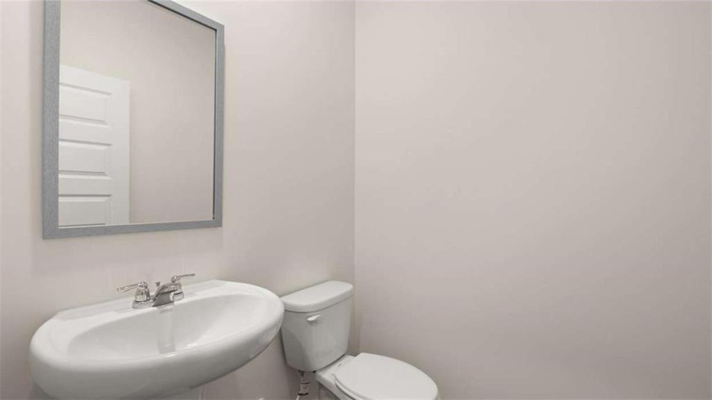 97 Defilippe Drive Statham, GA 30666 - Photo 27 of 58 a bathroom with a sink and a toilet