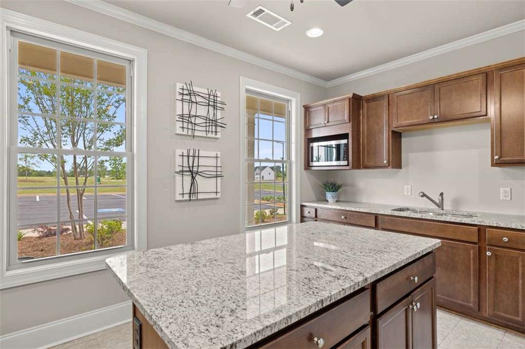 97 Defilippe Drive Statham, GA 30666 - Photo 53 of 58 a kitchen with stainless steel appliances granite countertop a sink and a counter space