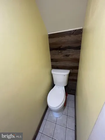 a bathroom with a toilet and a sink