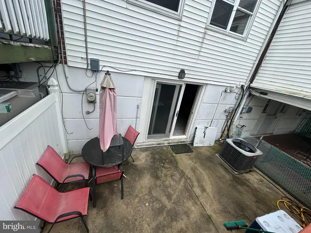 a backyard of a house with seating space
