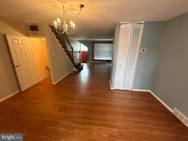 a view of a livingroom with wooden floor