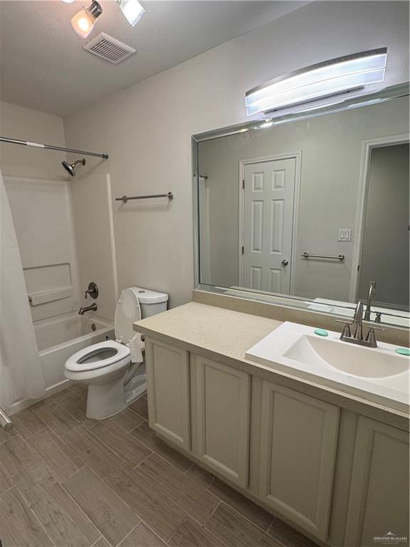 4110 Santa Fabiola Mission, TX 78572 - Photo 9 of 11 a bathroom with a granite countertop sink toilet a mirror and shower