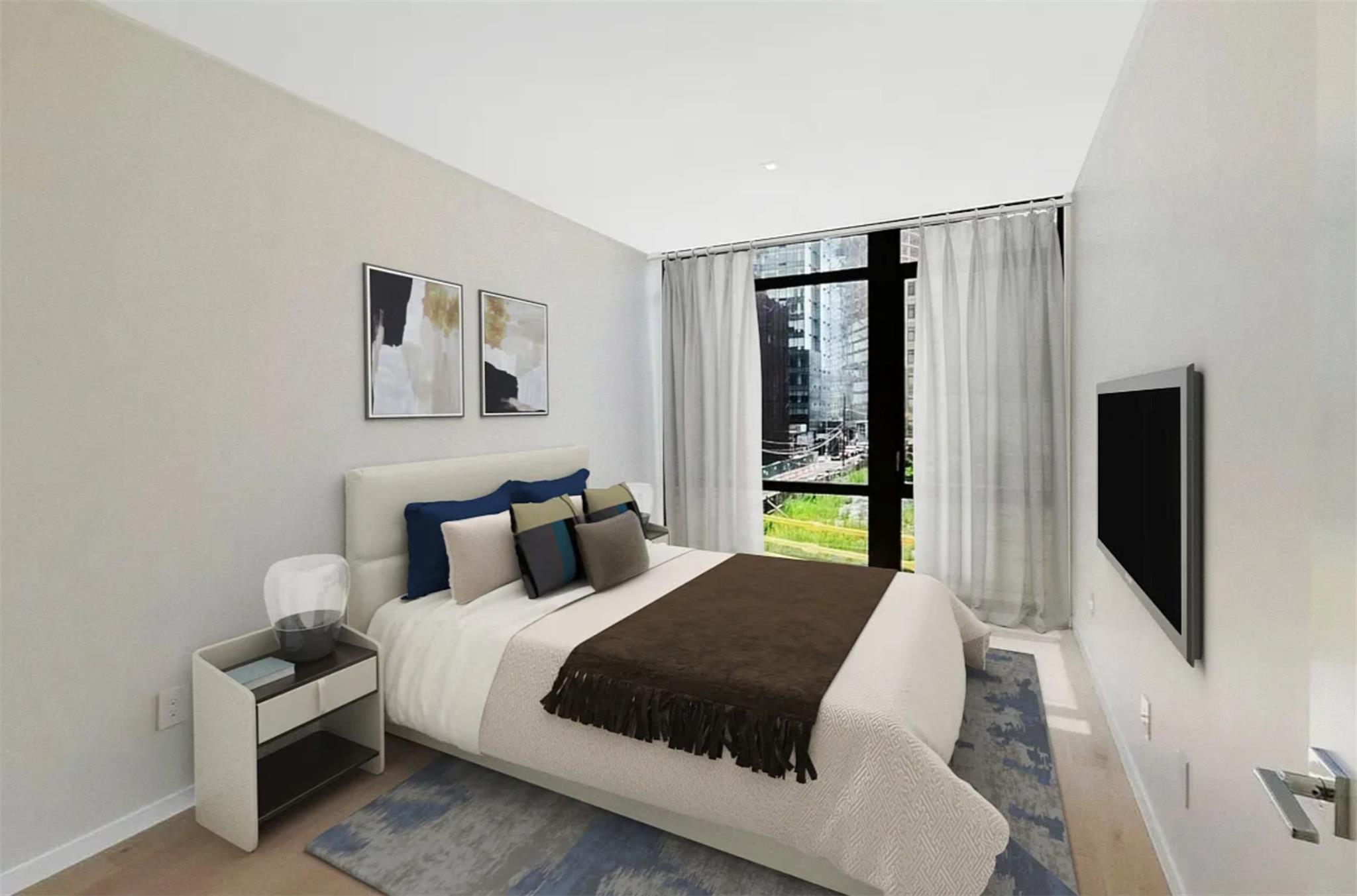 24-12 42nd Road, Unit 3E Queens, NY 11101 - Photo 5 of 13 Bedroom with multiple windows and expansive windows