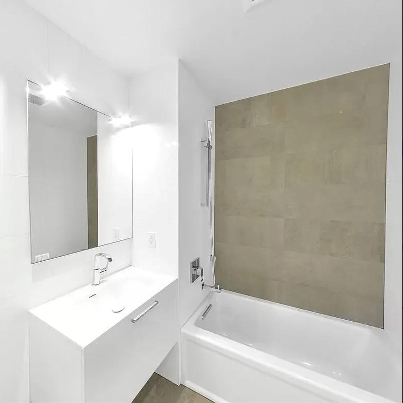 24-12 42nd Road, Unit 3E Queens, NY 11101 - Photo 9 of 13 Full bath featuring vanity and shower / bath combination