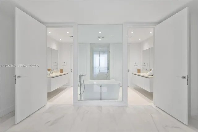 a bathroom with a sink a tub and a shower