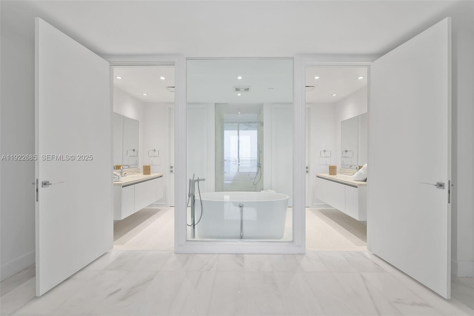 700 Northeast 26th Terrace, Unit 3602 Miami, FL 33137 - Photo 12 of 42 a bathroom with a sink a tub and a shower