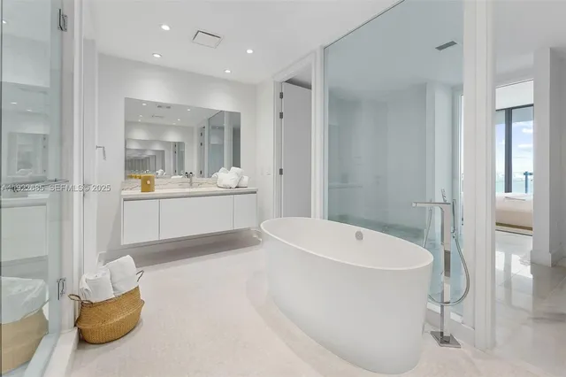 a bathroom with a bathtub and sink