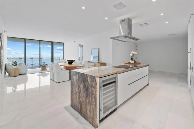 a kitchen that has a lot of cabinets in it