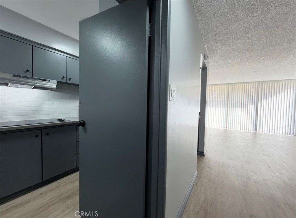 6979 Palm Court, Unit N242 Riverside, CA 92506 - Photo 2 of 27 a view of a kitchen from the hallway