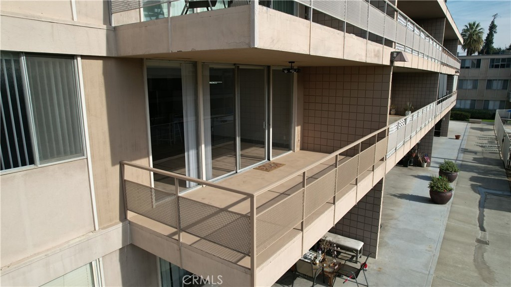 6979 Palm Court, Unit N242 Riverside, CA 92506 - Photo 27 of 27 a view of house with wooden stairs and furniture