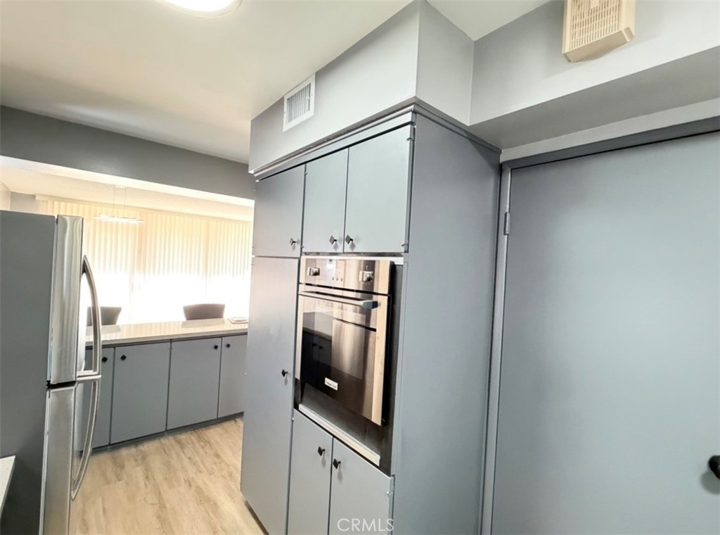 6979 Palm Court, Unit N242 Riverside, CA 92506 - Photo 5 of 27 a kitchen with stainless steel appliances granite countertop a refrigerator and a sink