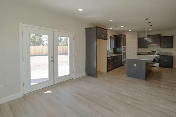 a view of an empty room with a bathroom