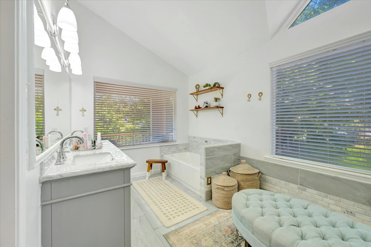 112 Oak Road Clear Lake Shores, TX 77565 - Photo 19 of 41 THE PRIMARY BATH HAS BEEN UPDATED WITH HIS AND HER VANITIES WITH MARBLE COUNTERS.