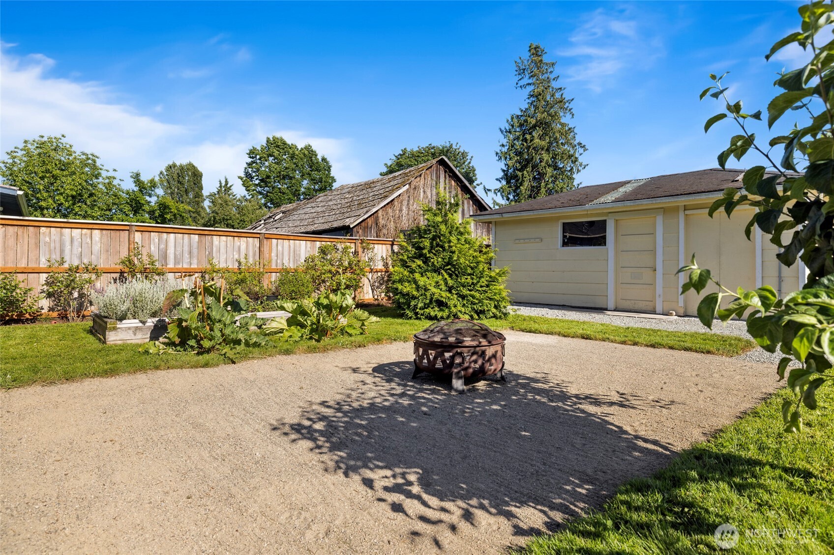 415 Sterling Street Sedro-Woolley, WA 98284 - Photo 28 of 38 a view of a back yard with flower plants