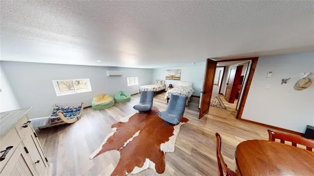 a living room with furniture rug and a window