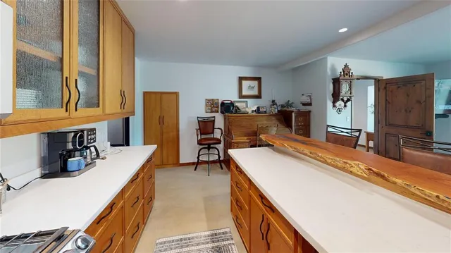 a room with furniture a flat screen tv and a bed