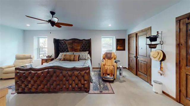 a bedroom with furniture and a window