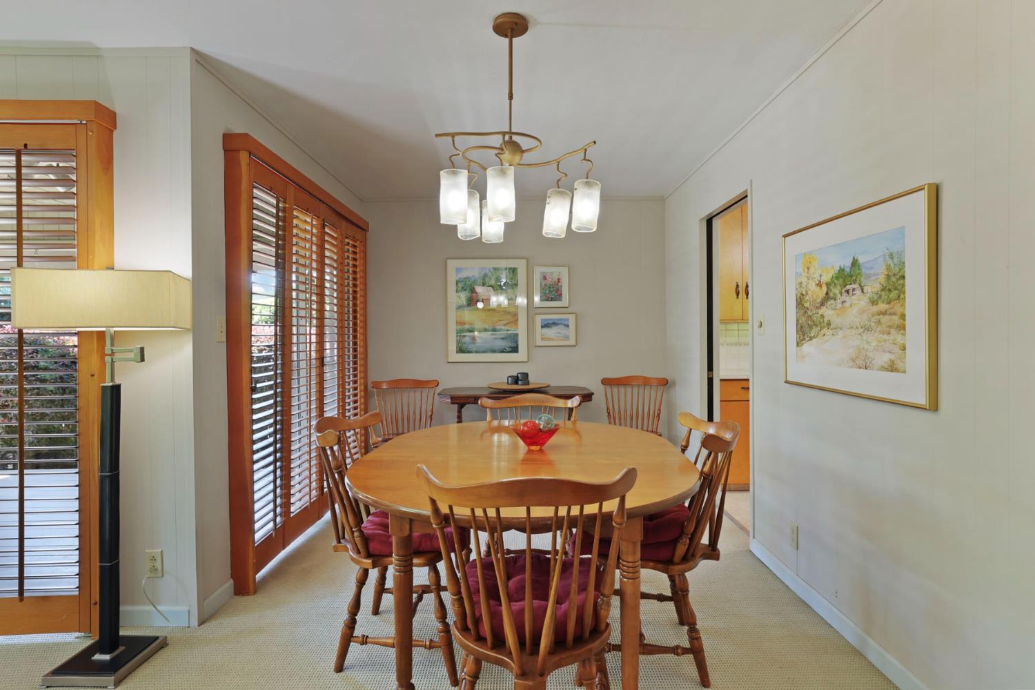 2406 Kenmore Court Modesto, CA 95350 - Photo 17 of 54 a dining room with furniture and window