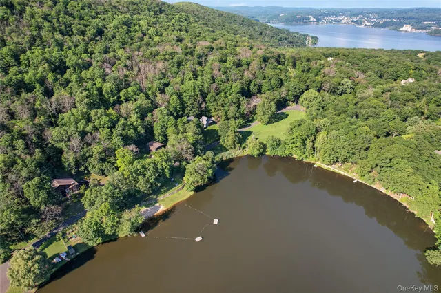 an aerial view of a houses with a yard