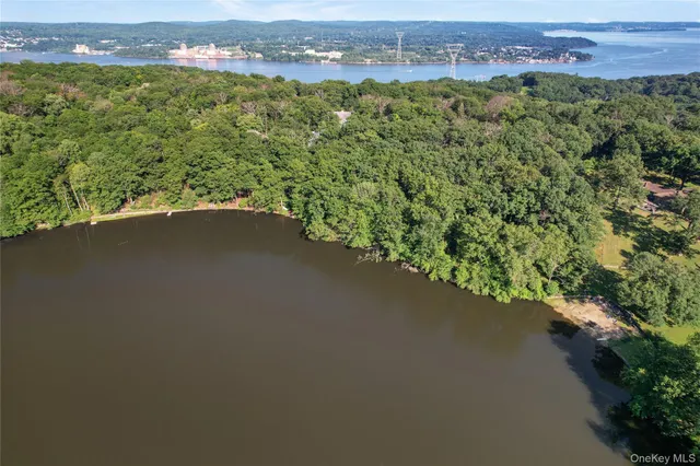 an aerial view of a houses with a yard