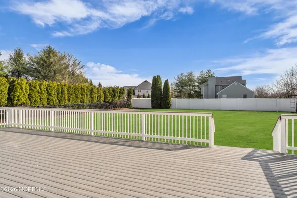 an aerial view of a house with a yard basket ball court and outdoor seating