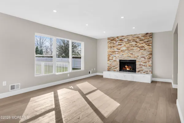 a kitchen with stainless steel appliances a stove refrigerator sink and microwave