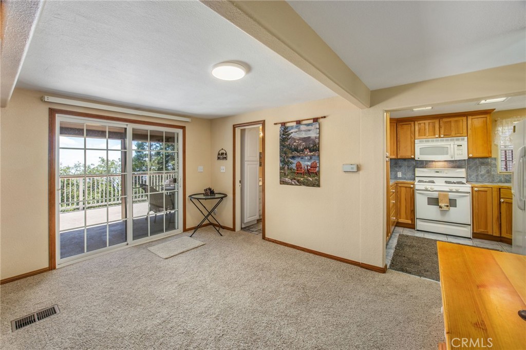 1134 Scenic Way Rimforest, CA 92378 - Photo 9 of 37 View from Living Room into Dining area and Kitchen