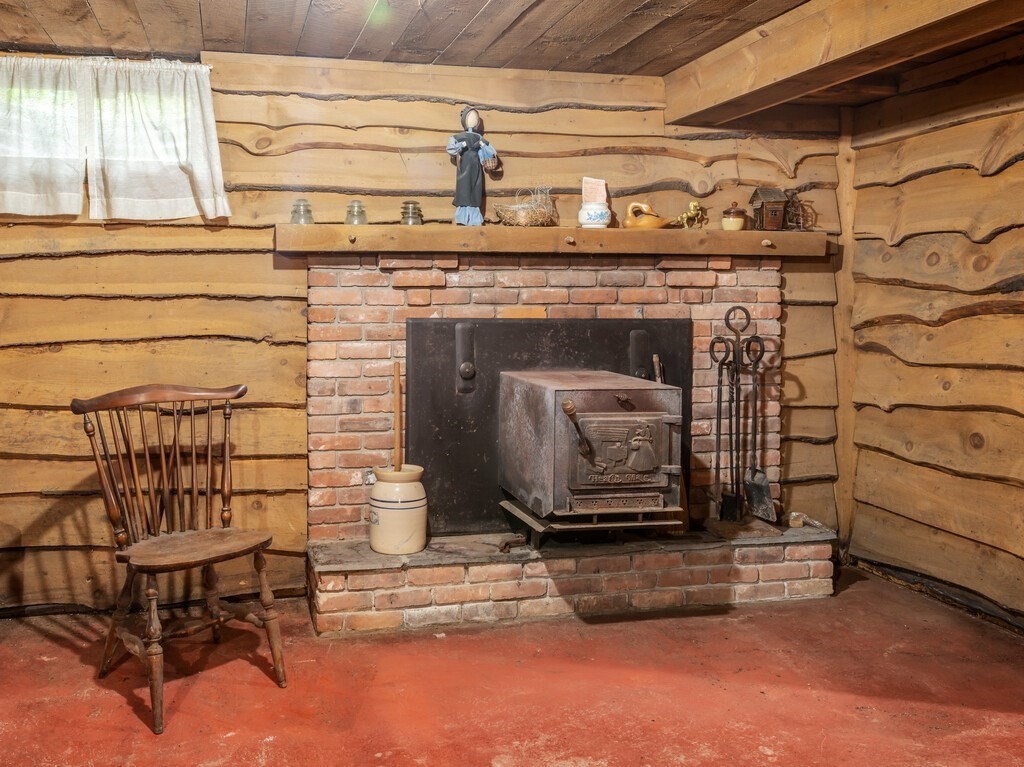 17 Wells Park Road Sturbridge, MA 01566 - Photo 28 of 37 a living room with a fireplace