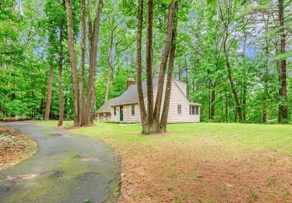 17 Wells Park Road Sturbridge, MA 01566 - Photo 37 of 37 a big house with large trees and a big yard with large trees