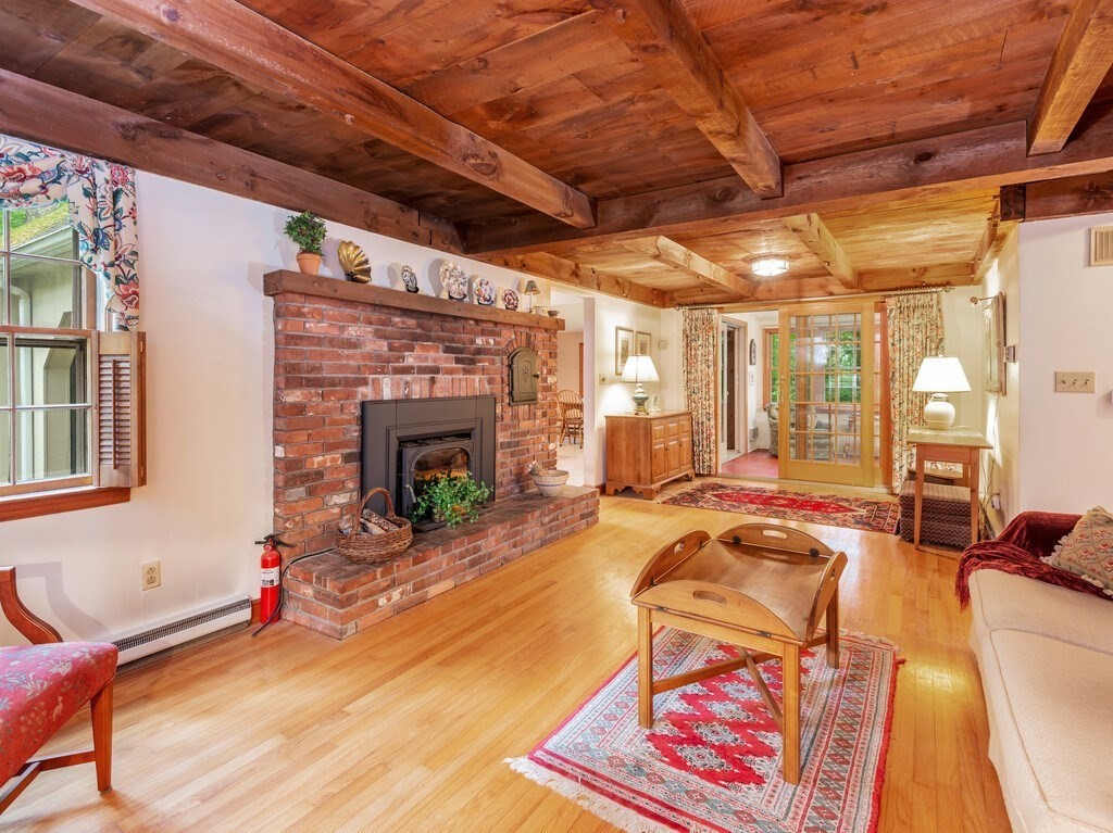 17 Wells Park Road Sturbridge, MA 01566 - Photo 6 of 37 a living room with furniture a fireplace and next to a window