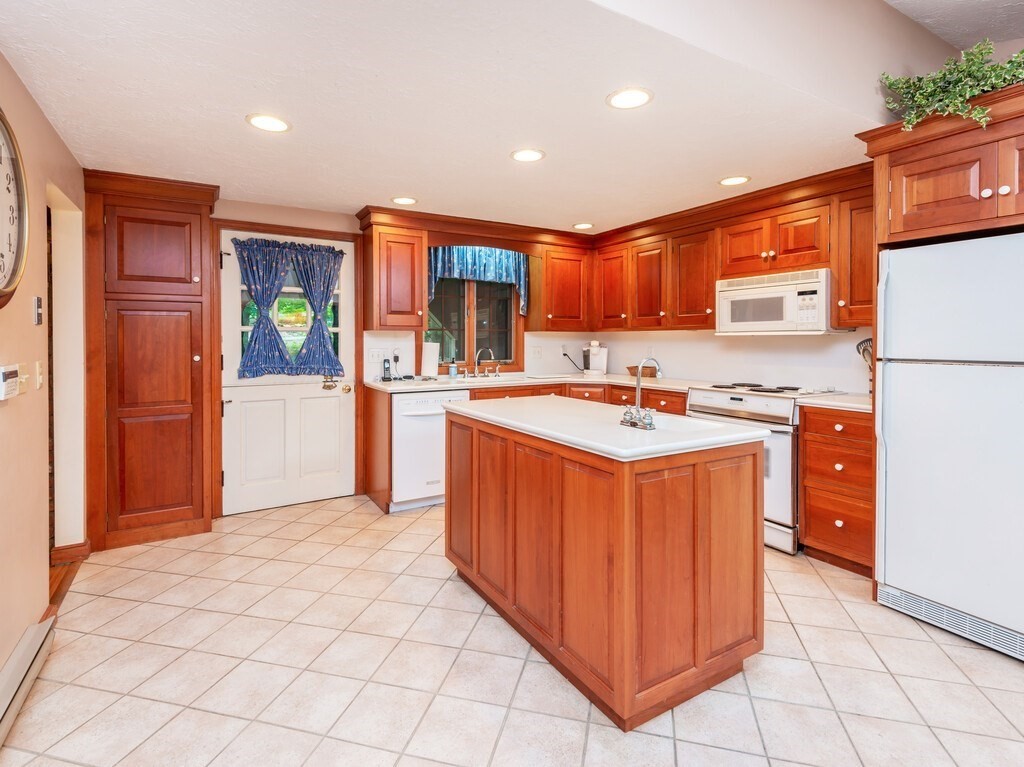 17 Wells Park Road Sturbridge, MA 01566 - Photo 8 of 37 a kitchen with stainless steel appliances granite countertop a stove sink and cabinets