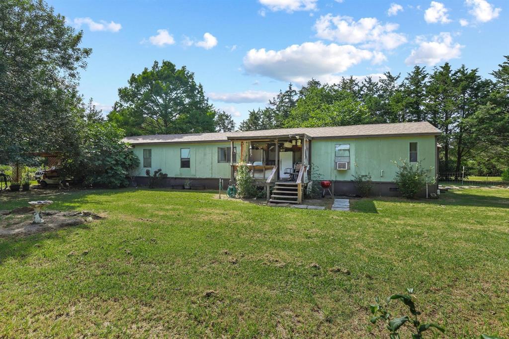 252 Meadow Lake Estates Road Denison, TX 75021 - Photo 19 of 37 Home- Back of property with view of back patio