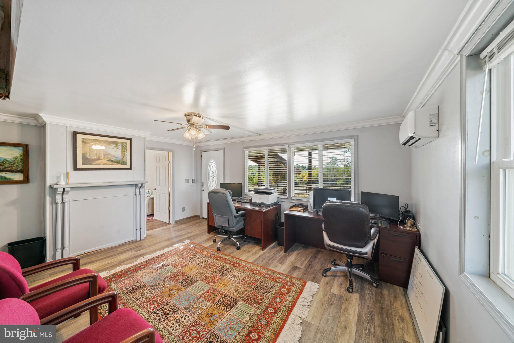 962 Wadesville Road Berryville, VA 22611 - Photo 18 of 63 a living room with furniture a rug and a large window