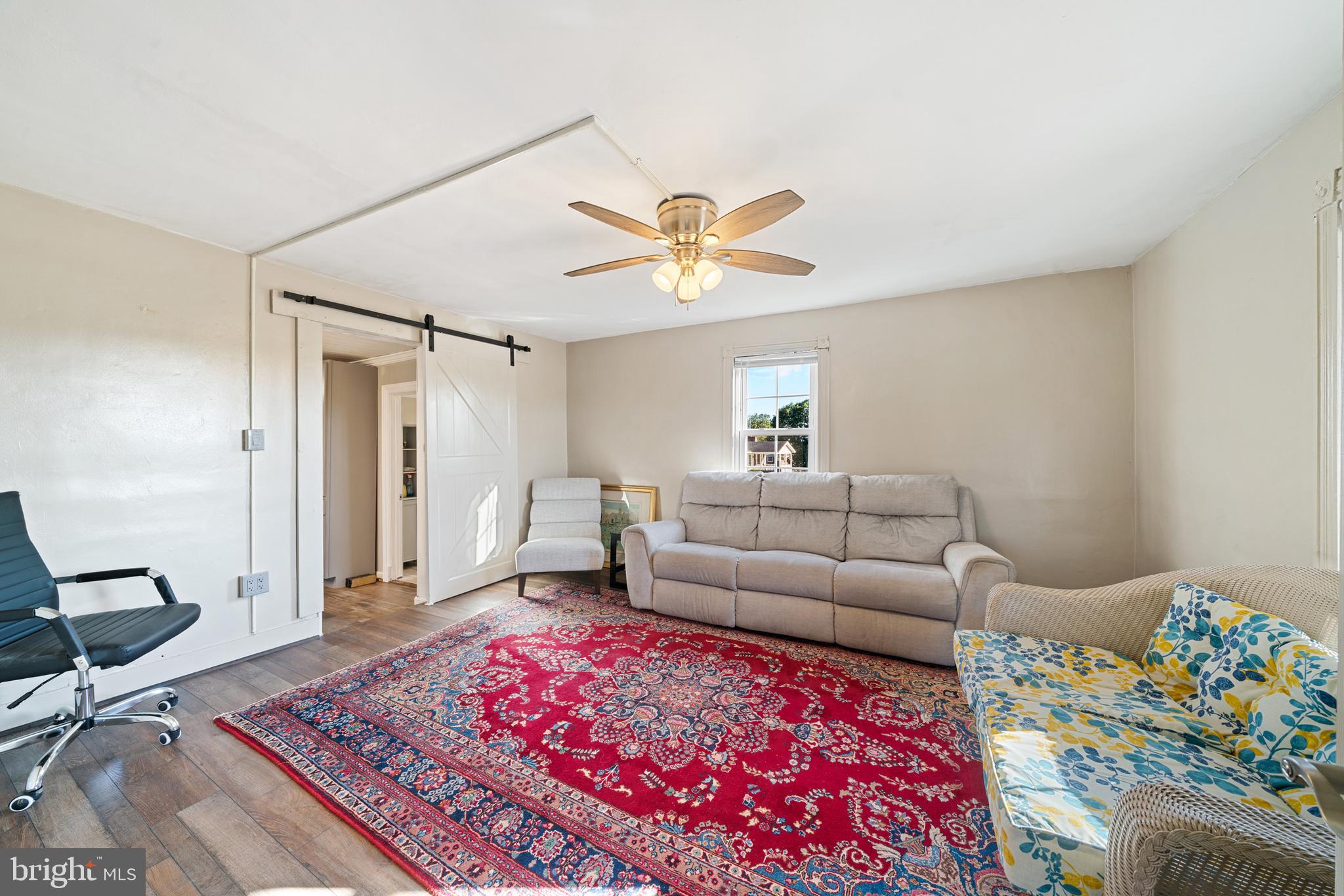 962 Wadesville Road Berryville, VA 22611 - Photo 21 of 63 a living room with furniture and a rug