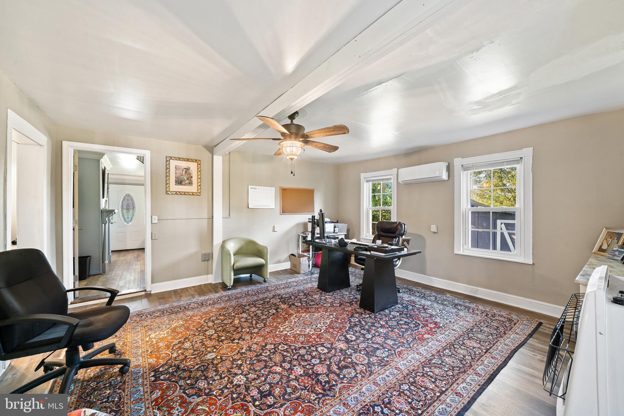 962 Wadesville Road Berryville, VA 22611 - Photo 23 of 63 a living room with furniture or couch and two windows