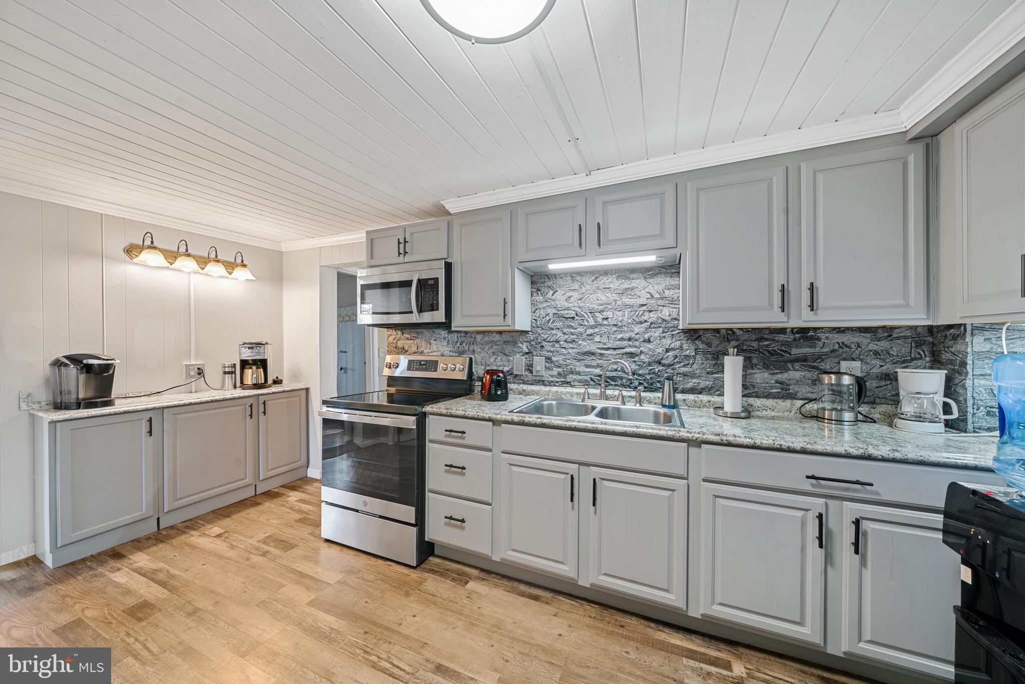 962 Wadesville Road Berryville, VA 22611 - Photo 28 of 63 a kitchen with cabinets appliances a sink and a counter top space