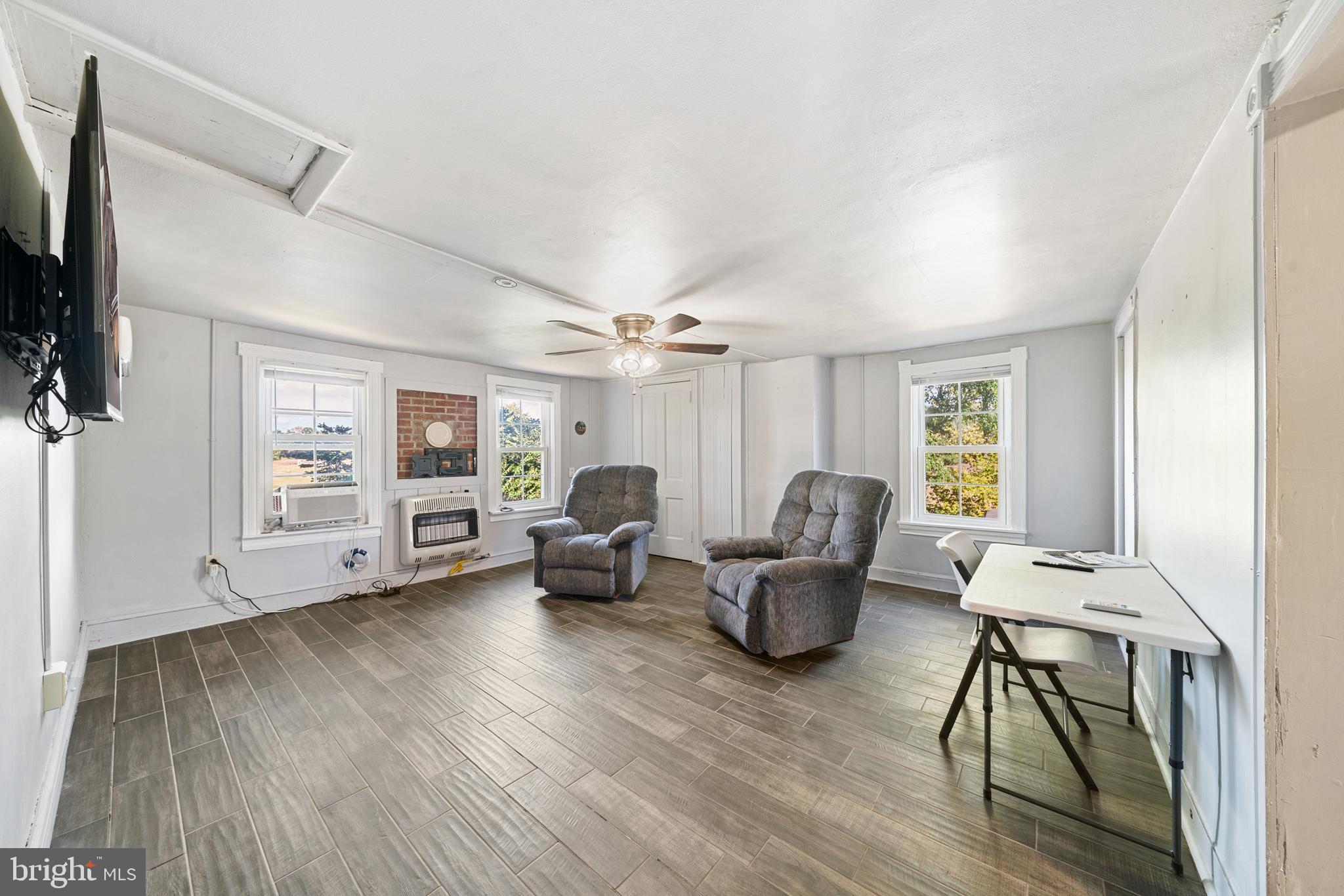 962 Wadesville Road Berryville, VA 22611 - Photo 33 of 63 a living room with furniture and a wooden floor