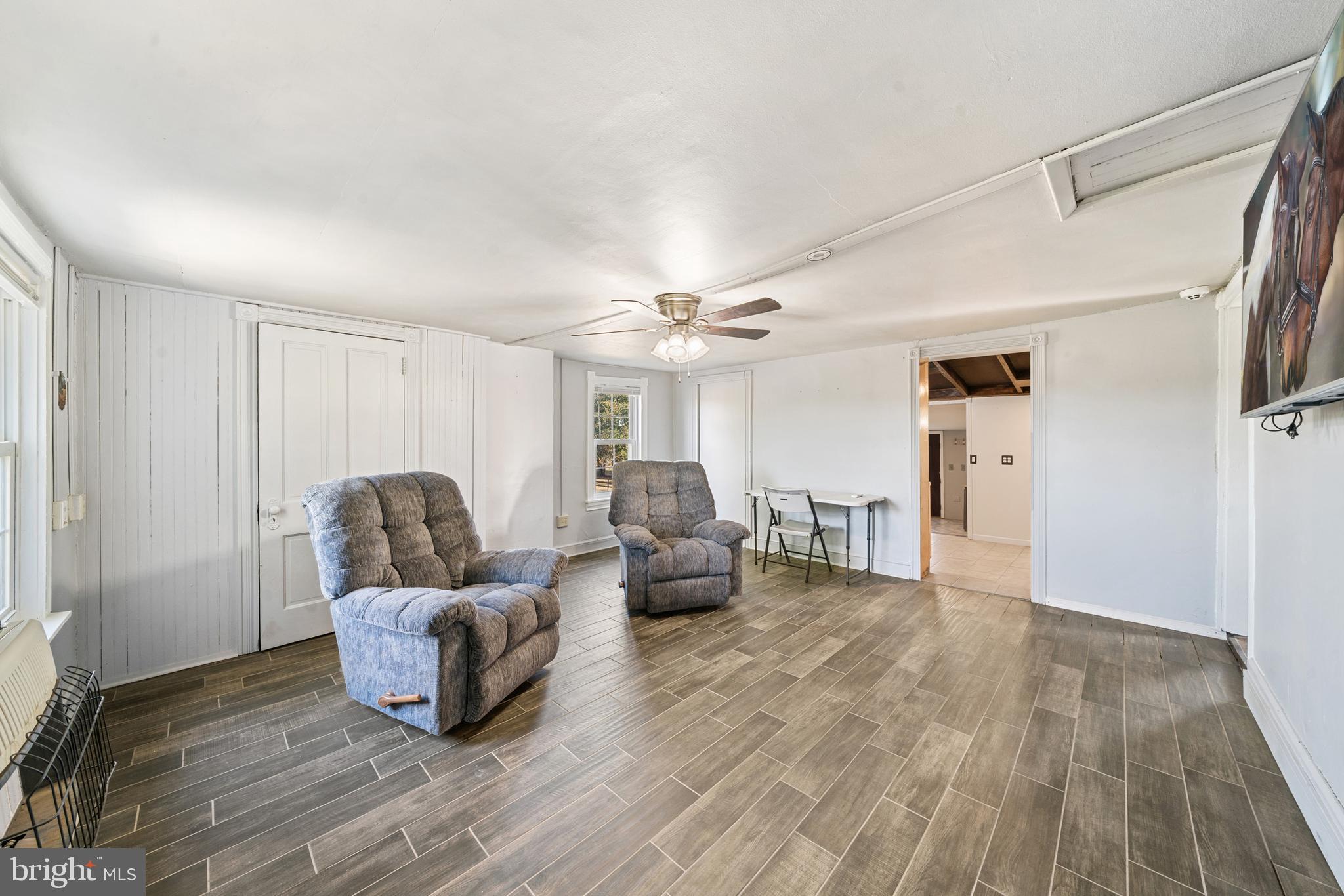 962 Wadesville Road Berryville, VA 22611 - Photo 34 of 63 a living room with furniture and a wooden floor