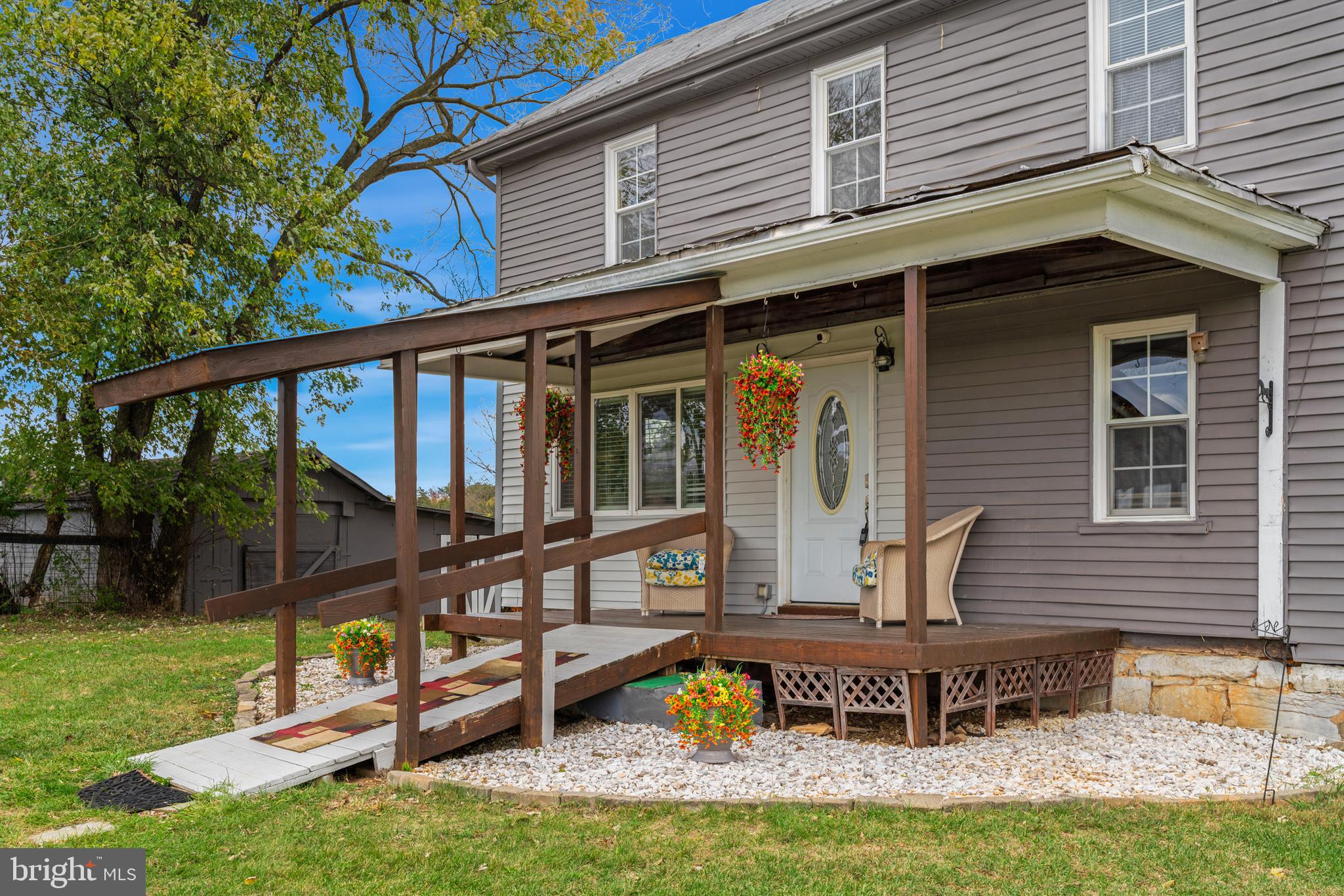 962 Wadesville Road Berryville, VA 22611 - Photo 49 of 63 a front view of house with a garden and swimming pool