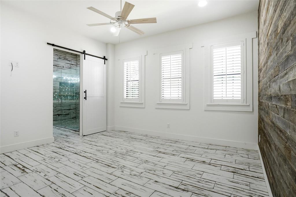 13240 Briar Road Azle, TX 76020 - Photo 13 of 39 a view of an empty room with wooden floor and a window