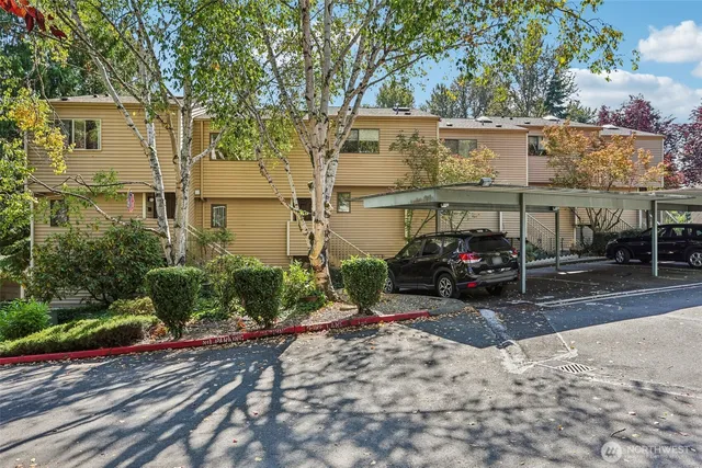 a view of a car park in front of a house