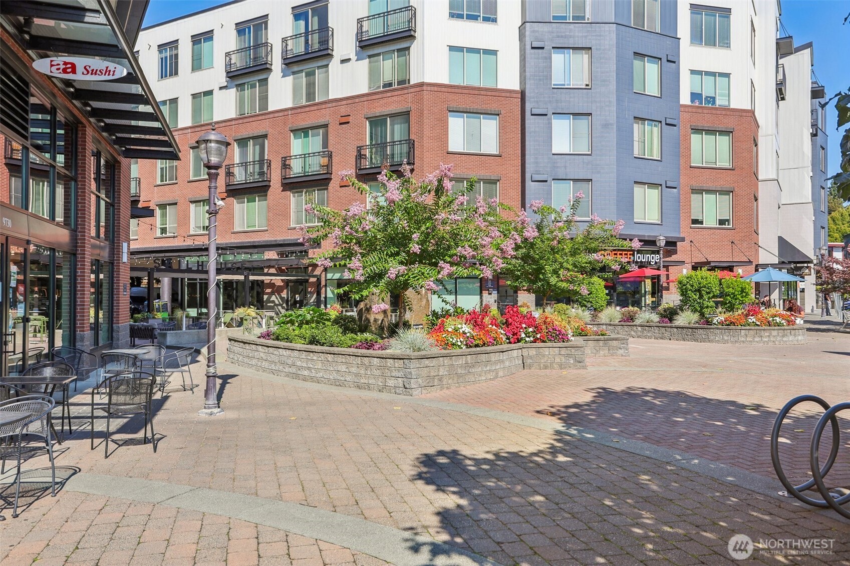 12044 96th Avenue Northeast, Unit 213 Kirkland, WA 98034 - Photo 21 of 24 a view of a building with sitting area