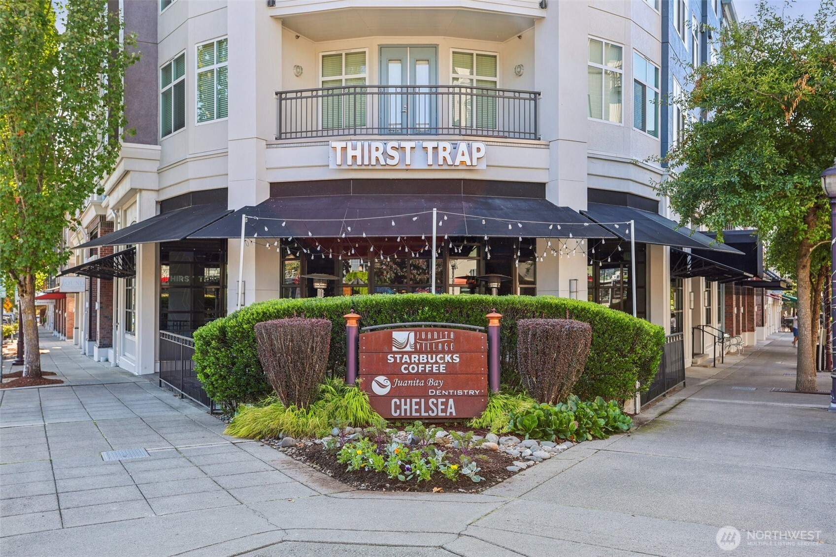 12044 96th Avenue Northeast, Unit 213 Kirkland, WA 98034 - Photo 22 of 24 a front view of a building with garden