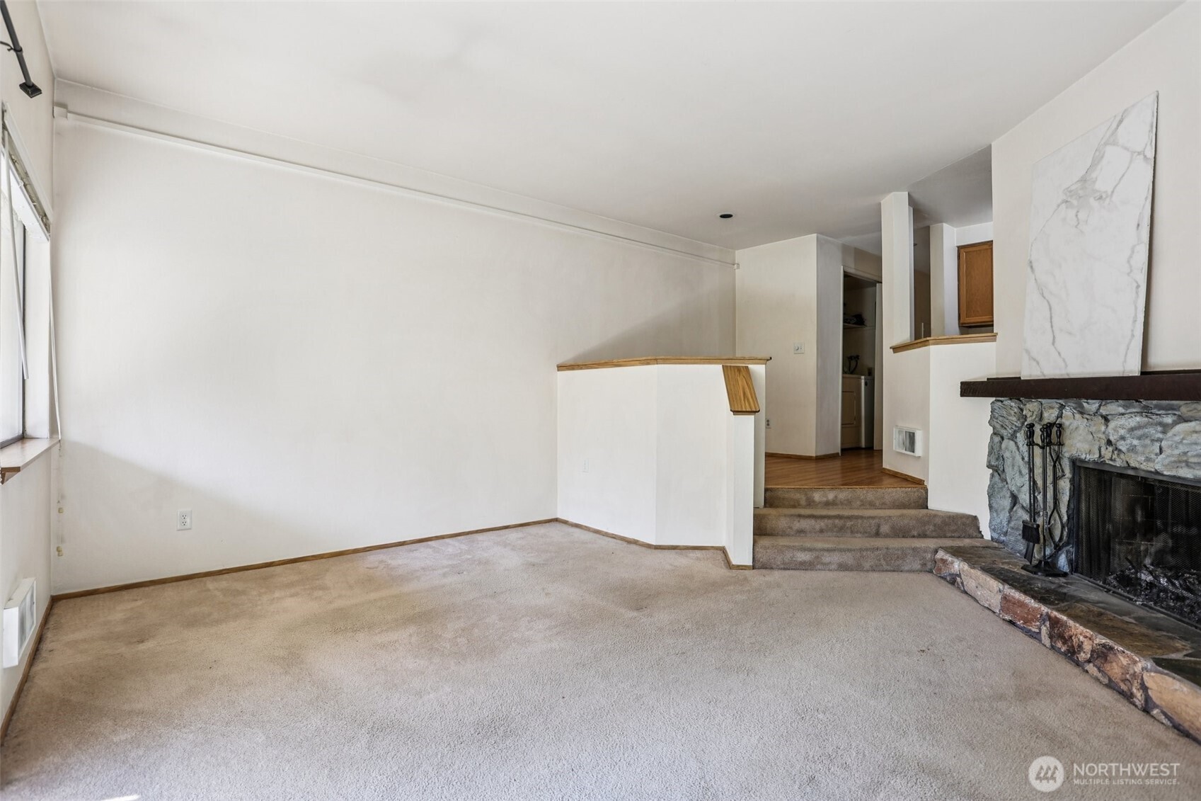 12044 96th Avenue Northeast, Unit 213 Kirkland, WA 98034 - Photo 5 of 24 a view of a livingroom with a fireplace