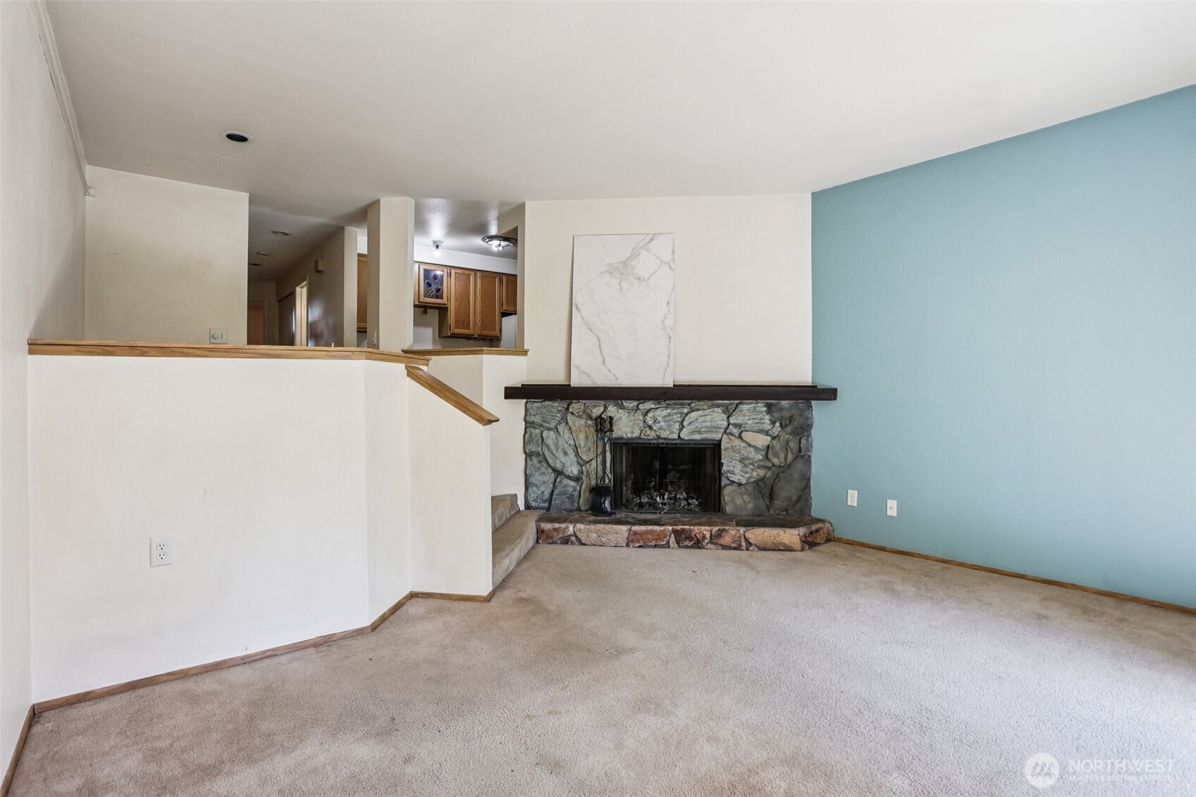 12044 96th Avenue Northeast, Unit 213 Kirkland, WA 98034 - Photo 6 of 24 a view of a room with furniture and a fireplace