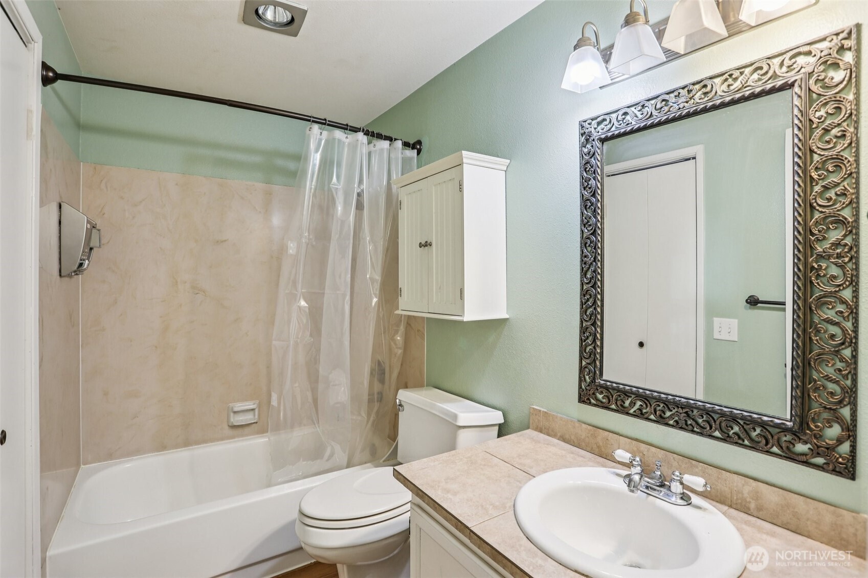 12044 96th Avenue Northeast, Unit 213 Kirkland, WA 98034 - Photo 9 of 24 a bathroom with a sink a toilet and shower