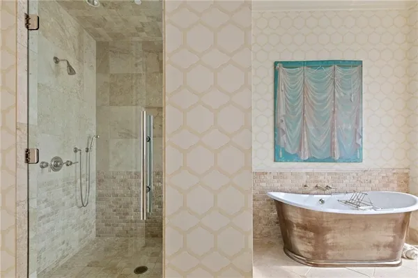 a bathroom with a bathtub and shower