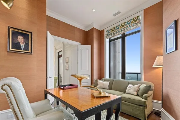 a reading room with furniture and a window