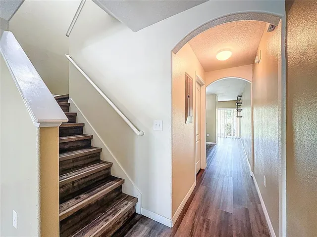 a large kitchen with stainless steel appliances granite countertop a stove a sink and a refrigerator